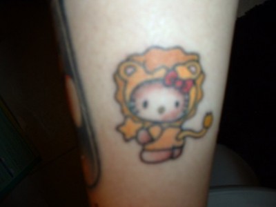 hello kitty lion tattoo