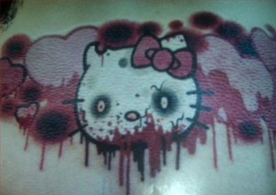 hello kitty heart eating zombie tattoo