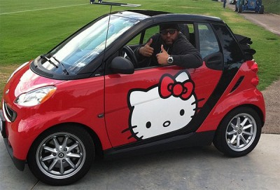 Antonio Garay, a football player, drives a Hello Kitty smart car