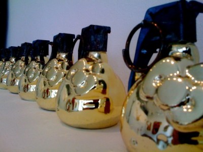 a line of gold Hello Kitty hand grenades