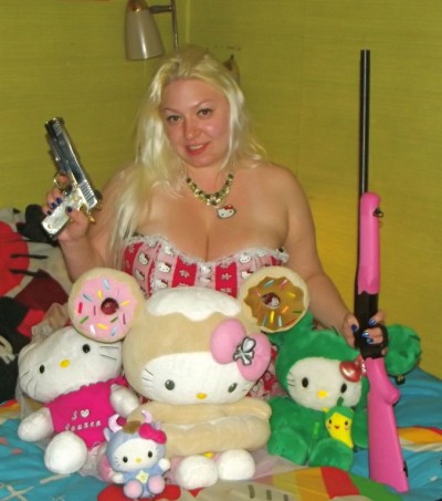 hello Kitty fanatic with rifle and hand gun