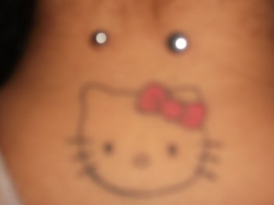 Hello Kitty neck tattoo