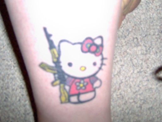 Hello Kitty assault rifle tattoo