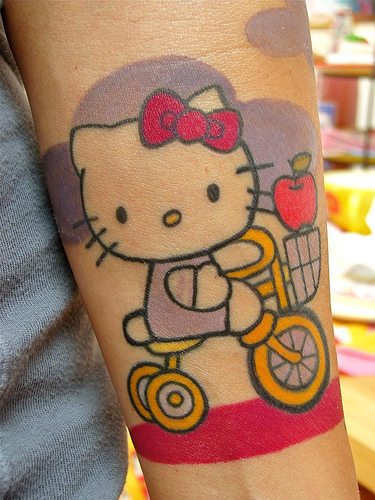 Hello Kitty tricycle tattoo