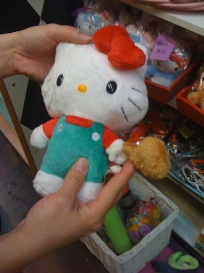 Hello Kitty holding chicken
